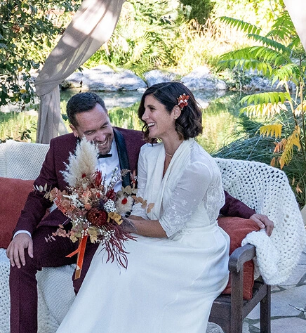 The newlyweds smile at Delphine, the officiant, before the start of the secular ceremony in Toulouse