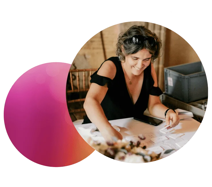 Delphine Goudy, a wedding planner in Toulouse, is busy sorting place cards for wedding tables in a reception hall in a castle. Credit: Sophie Bachère